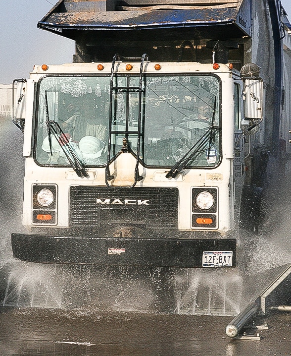 Dump truck wheels and chassis being washed