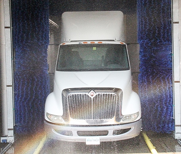 Large white truck being washed by InterClean wash system