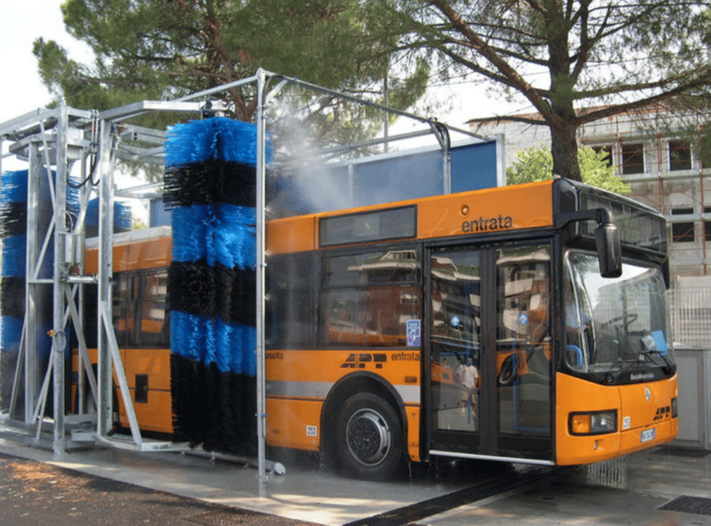 A transit bus in a bus wash system