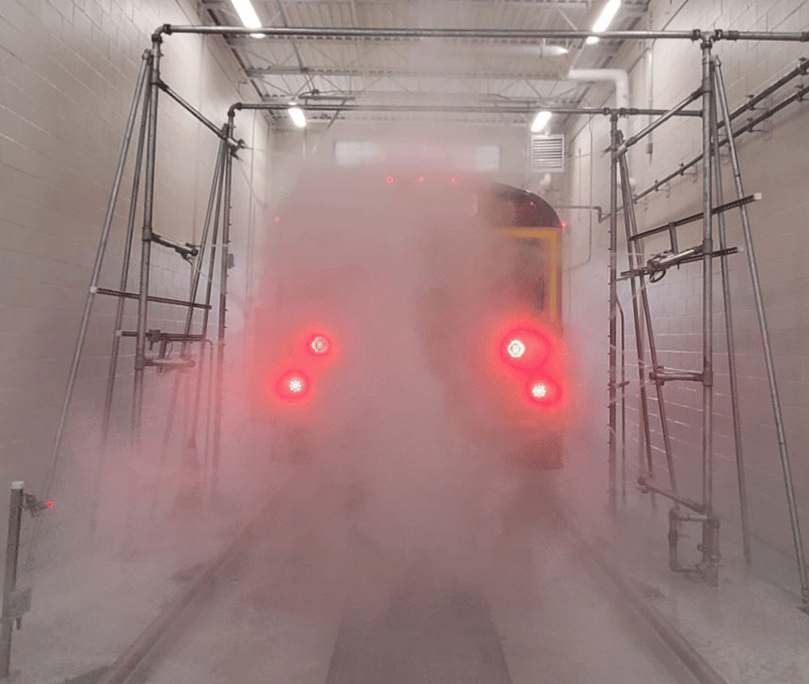 School bus going through wash bay.