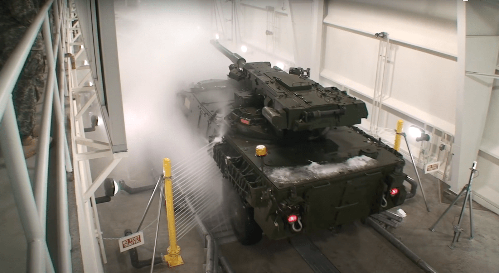 A military tank driving through an InterClean wash system