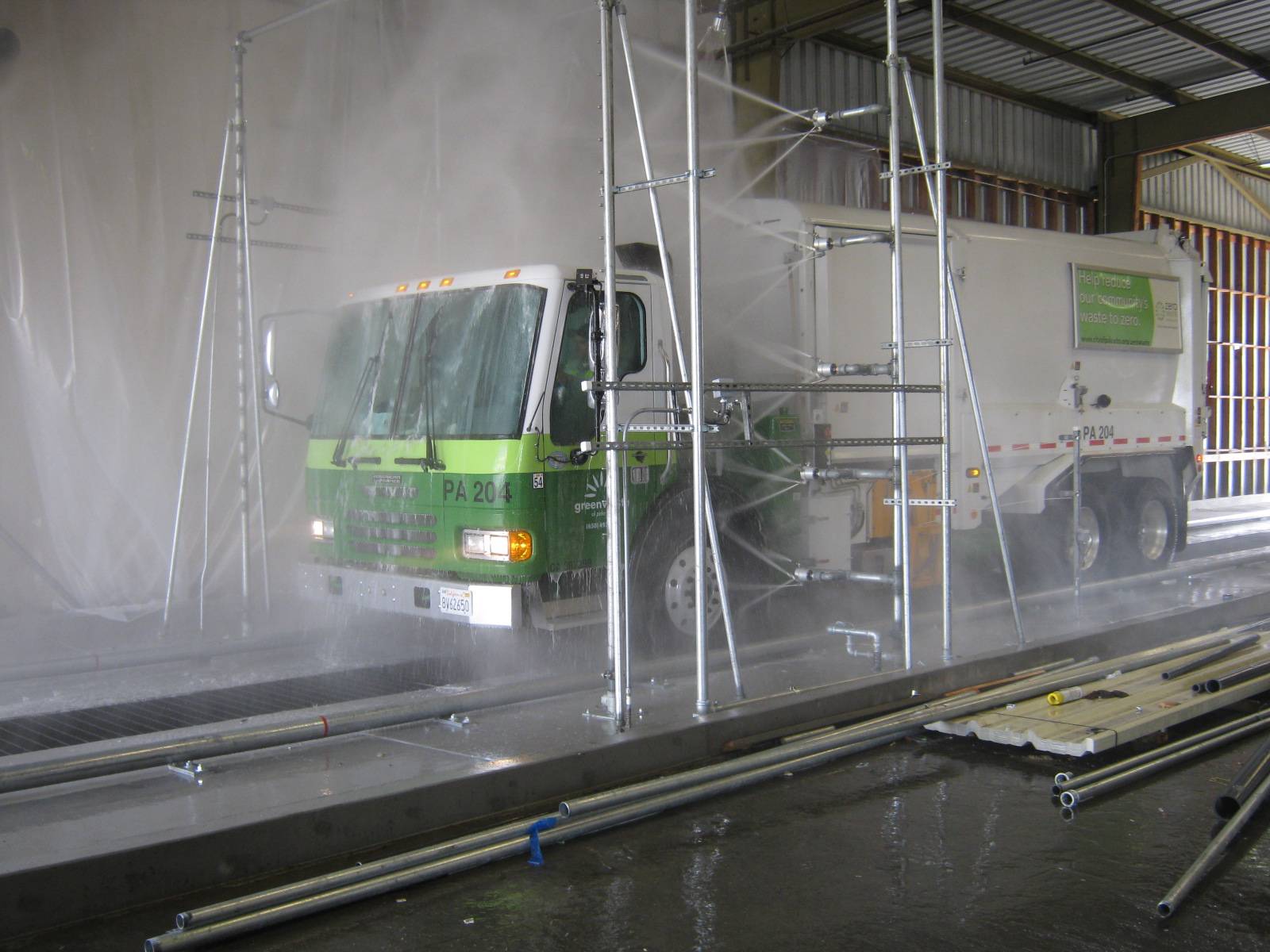 Truck being washed my municipal wash system.