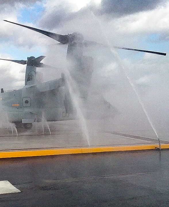 Aircraft being washed by clear water rinse system