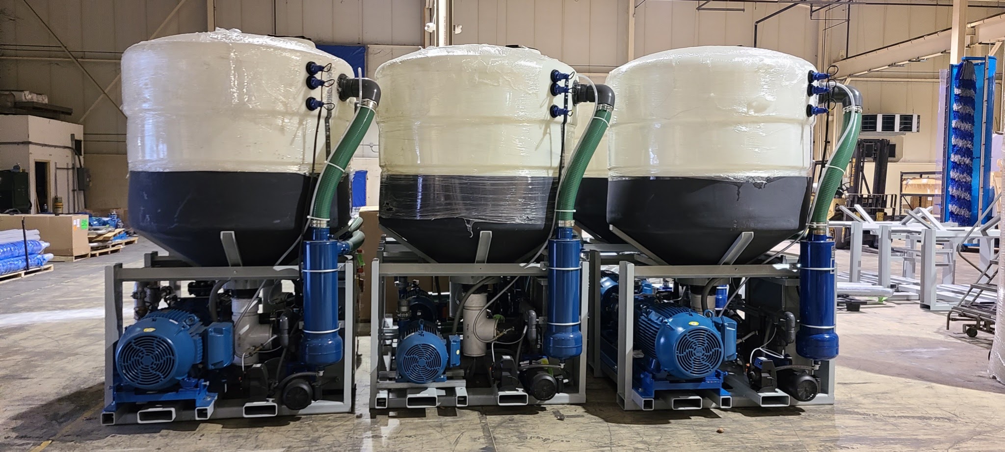 Three large detergent storage and distribution vats