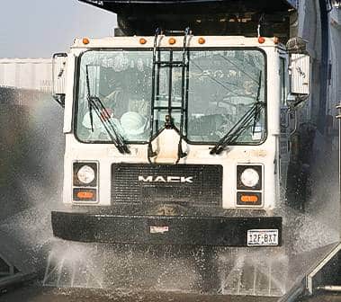 Truck being washed by municipal vehicle wash system