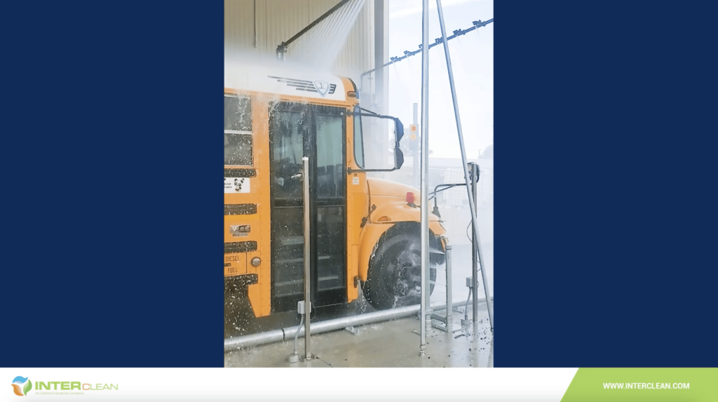 School bus in drive-through wash system