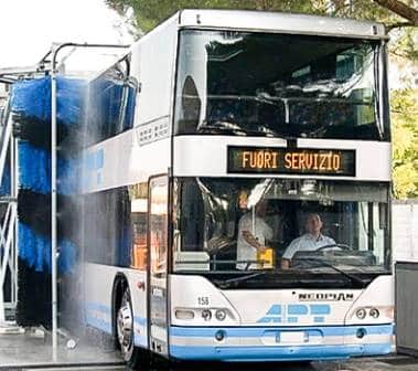 A bus being washed by an Interclean vehicle wash system.