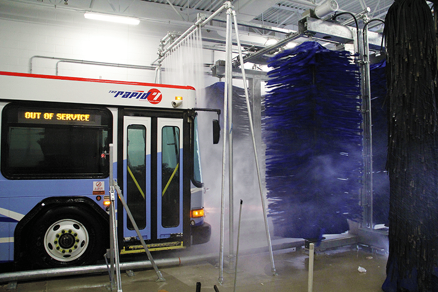 A bus being washed by an InterClean fleet wash system.