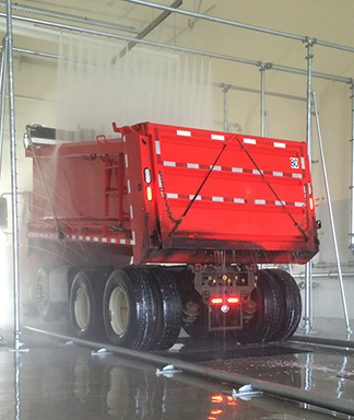 Touchless wash system for salt trucks and dump trucks.