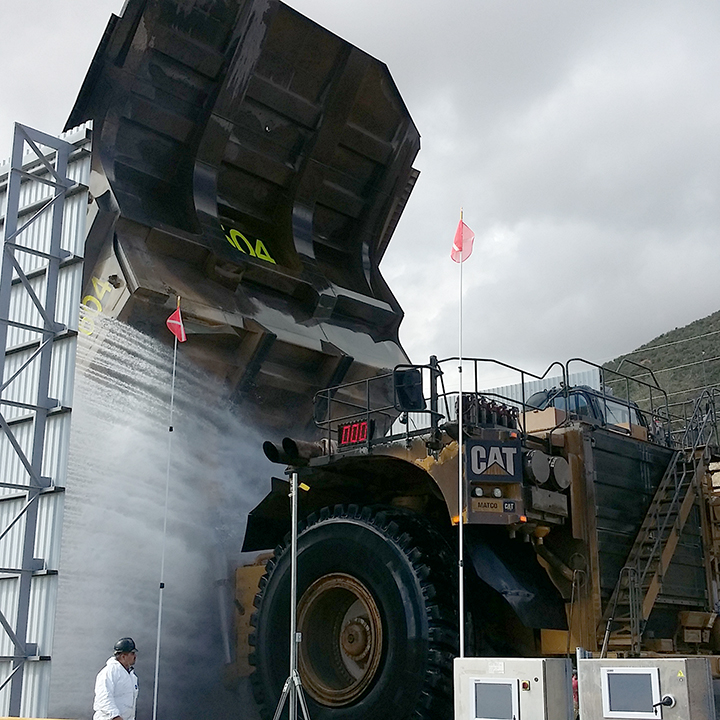 Side Spray Towers Washing a Haul Truck at Buenavista Del Cobre mine site