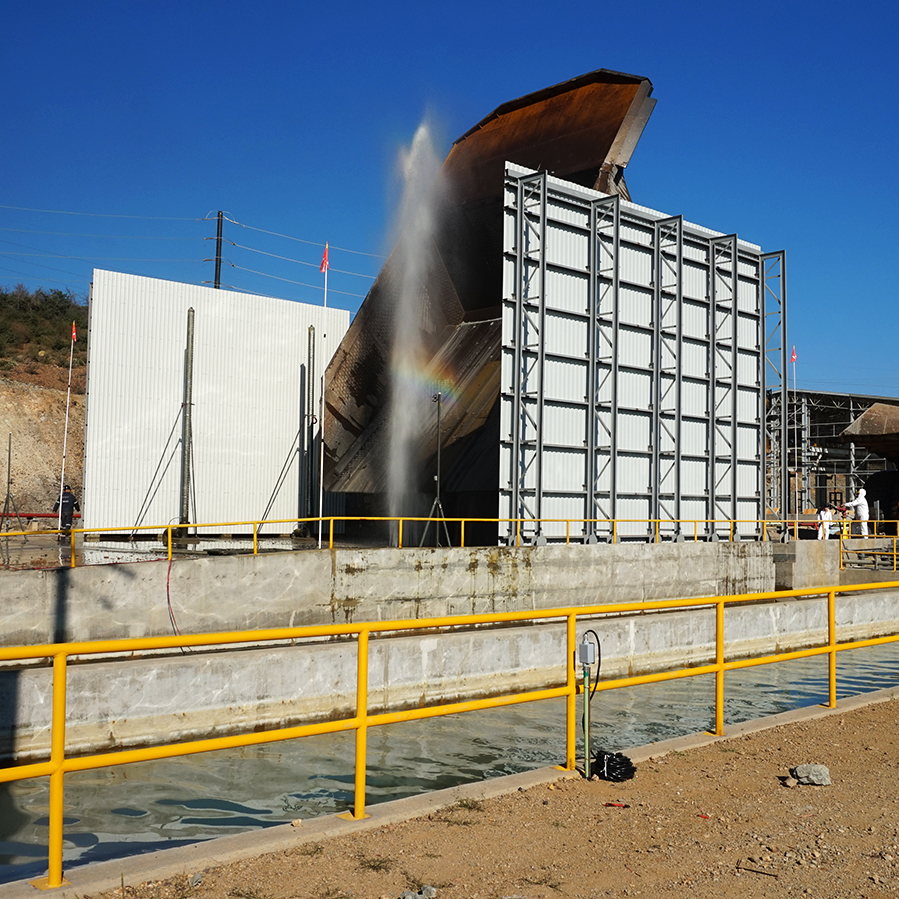 Water used for the side spray towers and chassis wash will drain into the water reclaim pit to be used again once the filtration process is complete, Buenavista del Cobre Mine Site