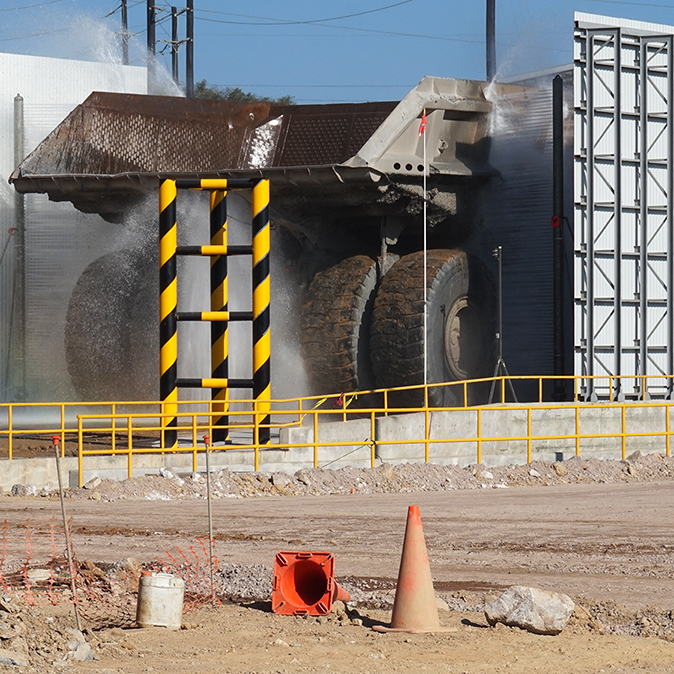 Rear Side Spray towers clean the rear of Haul Truck 641 enters the wash bay, Buenavista del Cobre Mine Site