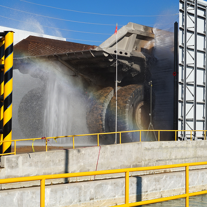Chassis wash starting as Haul Truck 641 enters the wash bay, Buenavista del Cobre Mine Site