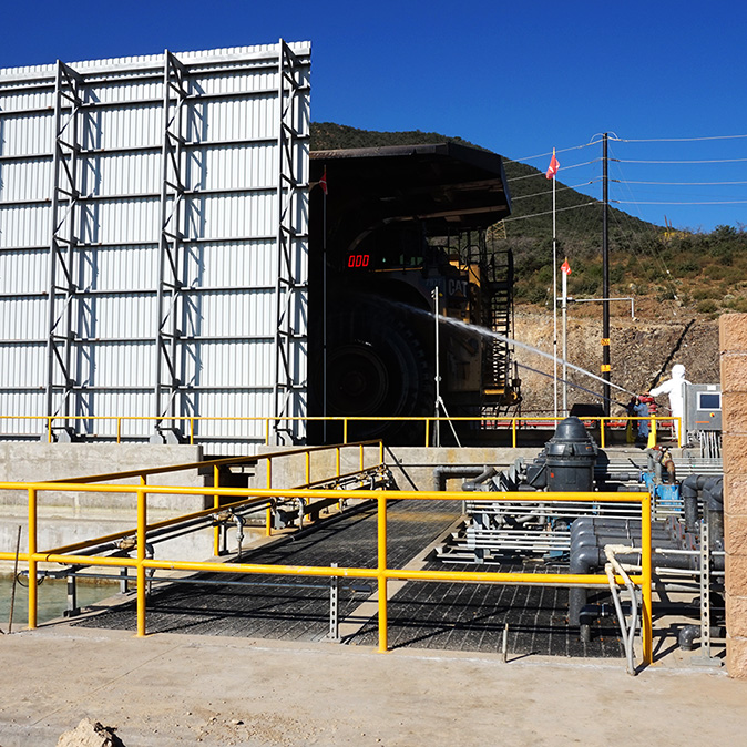High-pressure wash monitors are used by wash system operators to clean the front of Haul Truck 641, Buenavista del Cobre Mine Site
